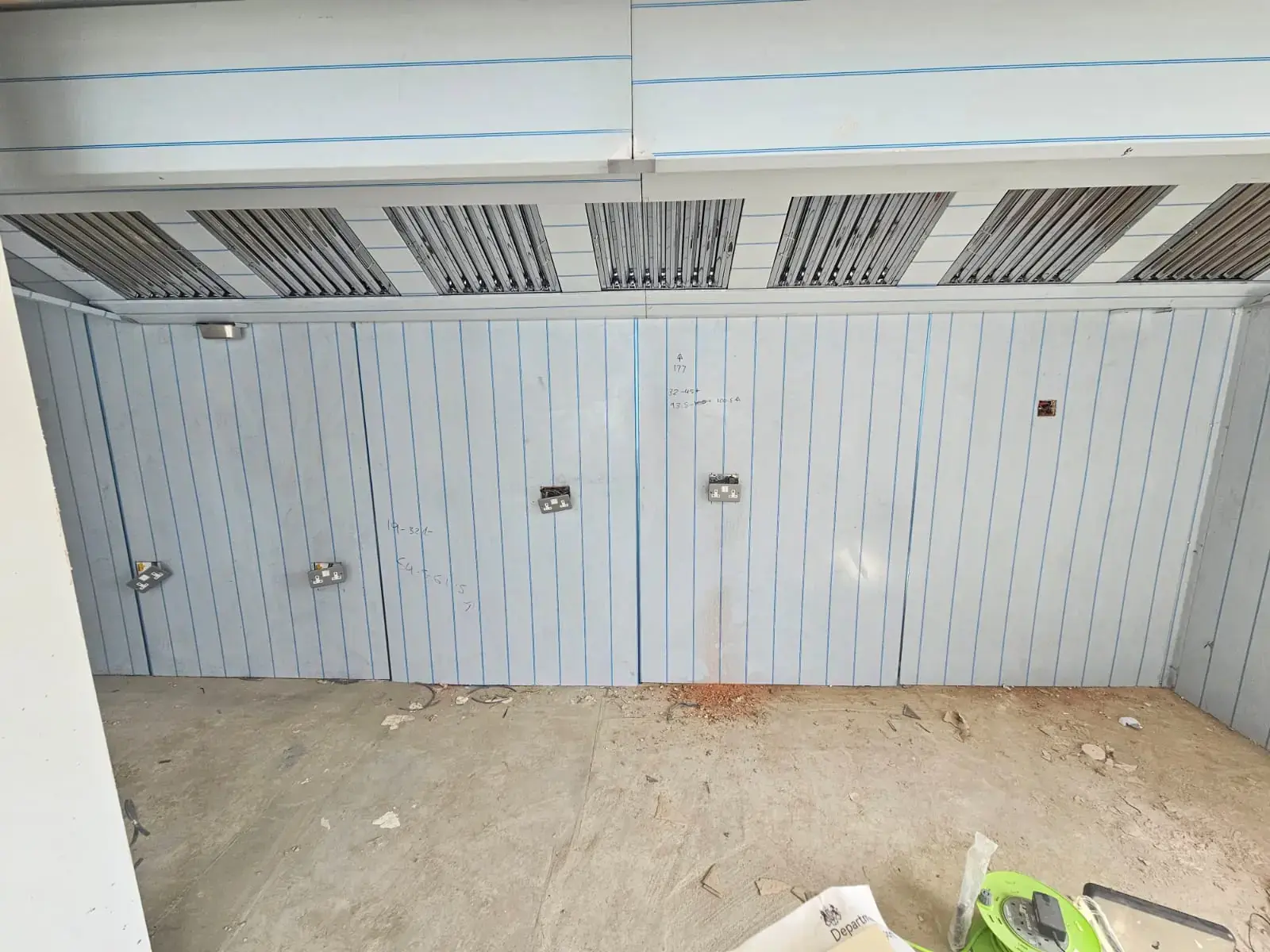 Stripped-out commercial kitchen with extraction canopy, ready for new gas pipework